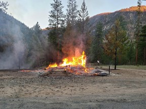 The burning remains of a church are shown in Chopaka, B.C. in a handout photo taken on Saturday, June 26, 2021.