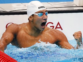 TOKYO, JAPAN - JULY 25: Ahmed Hafnaoui of Team Tunisia celebrates after winning the gold medal in the Men's 400m Freestyle Final on day two of the Tokyo 2020 Olympic Games at Tokyo Aquatics Centre on July 25, 2021 in Tokyo, Japan.