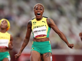 Elaine Thompson-Herah of Team Jamaica celebrates after winning the gold medal in the Women's 100m Final on day eight of the Tokyo 2020 Olympic Games.