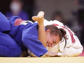 Ecaterina Guica of Canada in action against Charline Van Snick of Belgium.