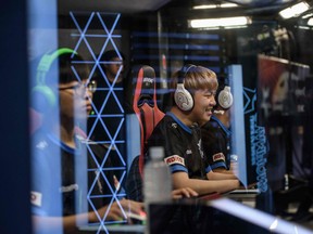 In a photo taken on July 11, 2018, members of professional eSports team 'Afreeca Freaks' prepare to compete in a 'League of Legends' competition in Seoul. South Korea enjoys ultra-fast broadband and a vibrant Internet culture, and internet cafes armed with powerful high-end computers catering to school-age gamers can be found on many street corners.