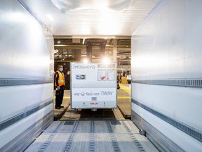 FedEx employees load a shipment from Europe of the Moderna vaccine against the coronavirus disease (COVID-19) into a refrigerated delivery truck at Toronto Pearson Airport in Mississauga, Ontario, Canada March 24, 2021.