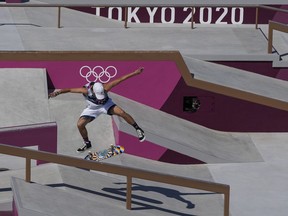 Jagger Eaton, who went on to win a bronze medal, performs a trick during the first Olympic skateboarding event in Tokyo. MUST CREDIT: Washington Post photo by Toni L. Sandys.