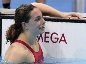 Canada's Penny Oleksiak reacts after swimming to take the bronze medal in the women's 200m freestyle final event during the Tokyo Summer Olympic Games, in Tokyo, Wednesday, July 28, 2021.