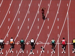 Aveni Miguel of Angola reacts to a false start leading to his disqualification REUTERS/Fabrizio Bensch