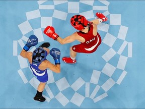 Nina Radovanovic of Serbia in action against Mandy Bujold of Canada REUTERS/Ueslei Marcelino