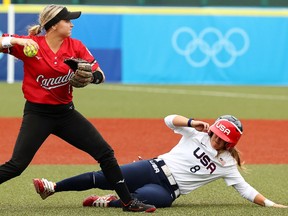 Tokyo 2020 Olympics - Softball - Women - Opening Round - United States v Canada - Fukushima Azuma Baseball Stadium - Fukushima, Japan - July 22, 2021. Kelsey Harshman of Canada and Haylie McCleney of the United States in action. REUTERS/Jorge Silva