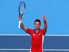 Novak Djokovic of Serbia celebrates after winning his first round match against Hugo Dellien of Bolivia.(REUTERS/Mike Segar)