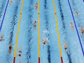 Tokyo 2020 Olympics - Swimming - Men's 400m Individual Medley - Finals - Tokyo Aquatics Centre - Tokyo, Japan - July 25, 2021. Swimmers during warm up before the event REUTERS/Antonio Bronic