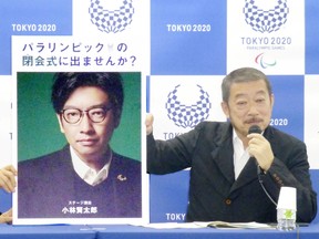 Hiroshi Sasaki, Tokyo 2020 Paralympic Games executive creative director, displays a portrait of Olympics opening ceremony show director Kentaro Kobayashi during a news conference in Tokyo, Japan. Both men have left the Olympics after scandal.