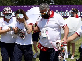 Svetlana Gomboeva collapsed as she checked her final scores and required assistance from staff and teammates who put bags of ice on her head to cool her down.