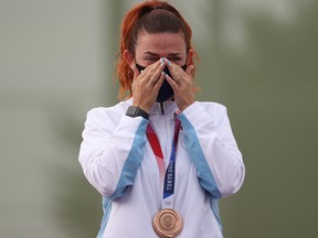Bronze Medalist Alessandra Perilli of Team San Marino on the podium following the Trap Women's Finals on day six of the Tokyo 2020 Olympic Games.