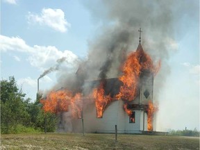 A former Polish Roman Catholic church near Redberry Lake, about 90 kilometres northwest of Saskatoon, burns to the ground on July 8, 2021.