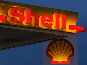(FILES) This file photo taken on January 30, 2009 shows company logos and signage displayed at a Shell petrol station in east London. Royal Dutch Shell on February 4, 2016 announced an 87-percent plunge in annual net profits on slumping oil prices. The Anglo-Dutch group reported profit after tax of 1.94 billion USD (1.75 billion euros) for 2015, compared with almost 15 billion USD the previous year, Shell said in a statement.