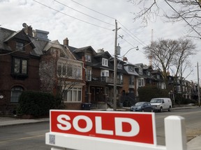 A "Sold sign" in front of homes in the Midtown neighborhood of Toronto, Ontario, Canada, on Thursday, March 11, 2021.