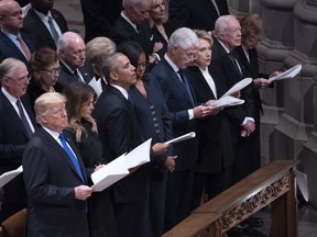 From left, Donald Trump, Melania Trump, Barack Obama, Michelle Obama, Bill Clinton, Hillary Clinton, Jimmy Carter and Rosalyn Carter attend the state funeral of former U.S. president George H.W. Bush at the National Cathedral in Washington, D.C., in 2018.