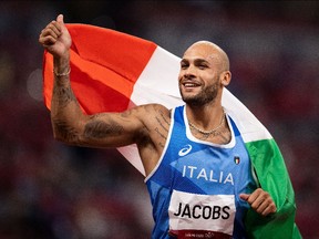 Lamont Marcell Jacobs of Team Italy celebrates after winning the Men's 100m Final.