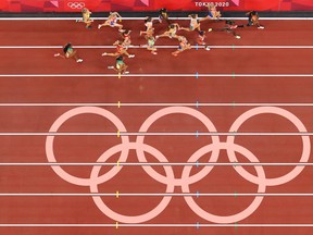 Athletes run past the on track olympic rings during the Women's 3000m Steeplechase Final on day twelve of the Tokyo 2020 Olympic Games at Olympic Stadium on August 04, 2021 in Tokyo, Japan. (Photo by Rob Carr/Getty Images)