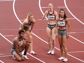 TOKYO, JAPAN - AUGUST 07: Alicia Brown, Madeline Price, Kyra Constantine and Sage Watson of Team Canada react after the Women's 4 x 400m Relay Final on day fifteen of the Tokyo 2020 Olympic Games at Olympic Stadium on August 07, 2021 in Tokyo, Japan.