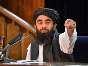 Taliban spokesperson Zabihullah Mujahid gestures during a press conference in Kabul on August 24, 2021 after the Taliban stunning takeover of Afghanistan.
