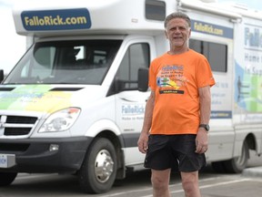 Rick Fall stands near his RV in Regina, Saskatchewan on June 4, 2021. Fall is running across Canada to raise money for Make-A-Wish Canada and Childhood Cancer Canada.