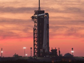 (FILES) This file handout image courtesy of NASA shows a SpaceX Falcon 9 rocket with the company's Crew Dragon spacecraft onboard at sunset on the launch pad at Launch Complex 39A as preparations continue for the Crew-2 mission, April 21, 2021, at NASA's Kennedy Space Center in Florida. - A crewed SpaceX mission to the International Space Station has been postponed by a day due to weather concerns downrange of the launch site, NASA said on August 3, 2021. Liftoff had been scheduled for August 5,2021 but because of unfavorable conditions along the Atlantic coast, it will now be set for 5:49 am (0949 GMT) on August 6, 2021.