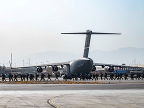 U.S. soldiers, assigned to the 82nd Airborne Division, arrive to provide security in support of Operation Allies Refuge at Hamid Karzai International Airport in Kabul, Aug. 20.