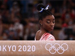 USA's Simone Biles gets ready to compete in the artistic gymnastics women's balance beam final of the Tokyo 2020 Olympic Games at Ariake Gymnastics Centre in Tokyo on August 3, 2021. (Photo by Lionel BONAVENTURE / AFP) (Photo by LIONEL BONAVENTURE/AFP via Getty Images)