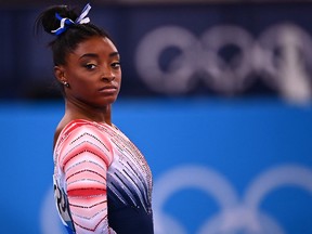 Simone Biles made a fearless return to competition on Tuesday, capping a tumultuous Tokyo Games with a bronze medal on the balance beam.