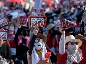 This file photo taken on Aug. 4, 2018 shows female protesters shouting slogans during a rally against 'spy-cam porn' in central Seoul.