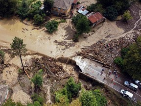 An aerial view shows a destroyed bridge in a flooded area following heavy rainfalls near Kastamonu, on August 11, 2021.