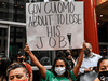 People protest against New York Governor Andrew Cuomo on August 4, 2021 in New York City.