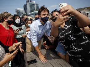 Justin Trudeau, Canada's prime minister, takes photos with supporters during a campaign stop in Richmond Hill, Ontario, Canada, on Friday, Aug. 27, 2021.