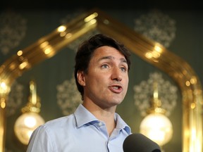 Canada's Prime Minister Justin Trudeau delivers a speech as he visits Nafisa Middle Eastern Cuisine restaurant during his election campaign tour in Mississauga, Ontario, Canada August 27, 2021.