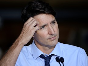 Canada's Prime Minister Justin Trudeau looks on during a news conference after visiting ETI Converting Equipment during his election campaign tour in Longueuil, Quebec, Canada August 16, 2021.