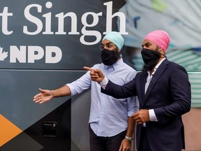 Federal New Democratic Party leader Jagmeet Singh stands next to his brother, Gurratan Singh, an Ontario MPP for the NDP, during his election campaign in Brampton, Ont. on  Aug. 16, 2021.