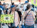 People attend a demonstration against COVID-19 measures put in place by the Quebec government, in Montreal on Aug. 21, 2021.