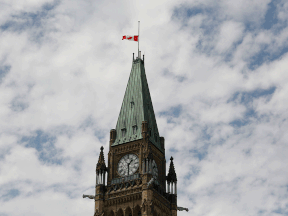 The Canadian flag flies at half-mast on Canada Day 2021, on Parliament Hill.