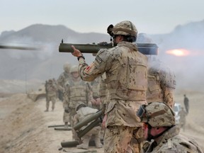 A Canadian Armed Forces soldier fires an M72 light anti-tank weapon at the Kabul Military Training Centre range in Kabul, Afghanistan on November 4, 2013.