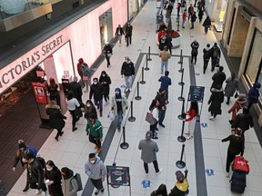 People wander around Eaton Centre in Toronto, Ontario, as the province reopens after meeting its vaccination targets.