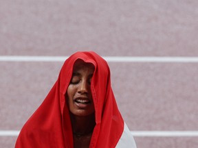 Netherlands' Sifan Hassan reacts after winning the women's 5000m final during the Tokyo 2020 Olympic Games.