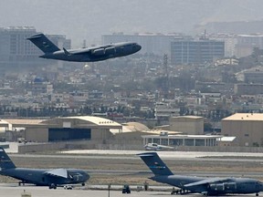US Air Force aircraft takes off from the airport in Kabul on August 30, 2021. Photo by Aamir QURESHI / AFP