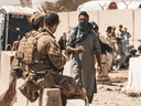 Canadian soldiers assist during an evacuation at Hamid Karzai International Airport in Kabul, August 24, 2021. Canada has now ended its evacuation efforts in Afghanistan.