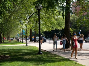 Students walk through the University of Michigan campus amid reports of college football cancellation, during the outbreak of COVID-19, in Ann Arbor, Michigan, U.S., Aug. 10, 2020.