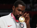 FILE: Kevin Durant of Team United States poses for photographs with his gold medal  during the Men's Basketball medal ceremony on day fifteen of the Tokyo 2020 Olympic Games at Saitama Super Arena on August 07, 2021 in Saitama, Japan. /