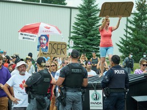 Protestors heckle Prime Minister Justin Trudeau during a Liberal campaign event in Cambridge, Ontario, on August 29, 2021. Photo by GEOFF ROBINS/AFP