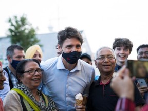 Justin Trudeau, Canadian Liberal Leader, poses with his ice cream at the Cows Creamy in Charlottetown, Prince Edward Island, Canada, August 22, 2021.