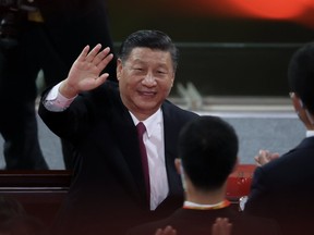 Chinese President Xi Jinping waves as he attends the art performance celebrating the 100th anniversary of the Founding of the Communist Party of China on June 28, 2021 in Beijing, China.