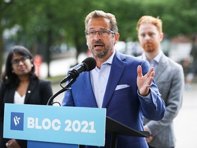 Bloc Québécois Leader Yves-François Blanchet speaks to the media as he continues his election campaign in Montreal on Aug. 30, 2021.