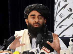 Taliban spokesman Zabihullah Mujahid speaks during a news conference in Kabul, August 17, 2021.